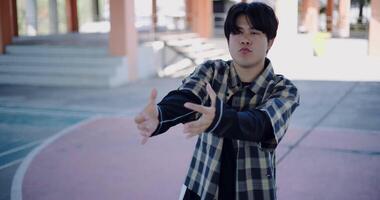 Handheld shot, Young man with dancing skills is practicing new moves by himself. Solo dance. video