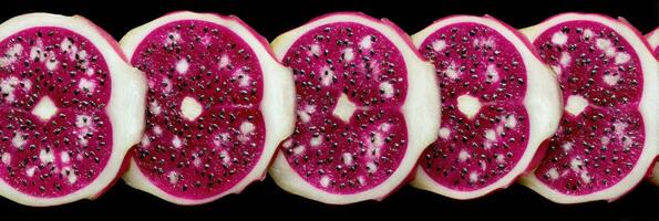 Symmetrical Overhead View of Sliced Dragon Fruit Showcasing Vibrant Colors and Unique Texture photo