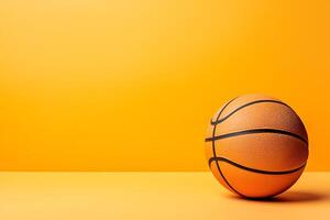 A Single Basketball on a Vibrant Yellow Background Perfect for Sports and Game-Related Designs. photo