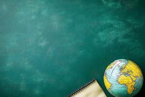 Teal Background with Globe and Notebook Perfect for Education or Travel Themes. photo