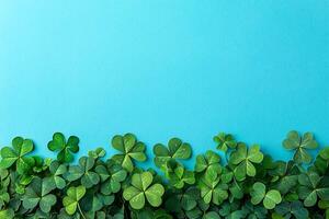 Vibrant Green Clover Leaf Border on a Bright Blue Background. A festive and cheerful image perfect for St. Patrick's Day or spring designs. photo