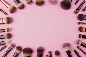 Makeup Brushes Arranged in a Frame on Pink Background Perfect for Beauty and Cosmetic Designs. photo