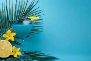 Tropical Blue Cocktail in Martini Glass with Palm Leaves and Plumeria Flowers. A refreshing summer beverage image. photo