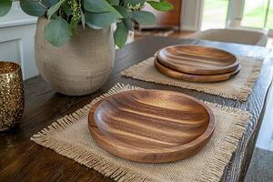 Rustic Wooden Serving Bowls and Placemats on a Dark Wood Table. A styled image perfect for home decor, food blogs, or restaurant websites. photo