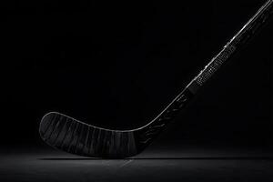 Dramatic Close-up of a Black Ice Hockey Stick on a Dark Background. A powerful image perfect for sports-related projects. photo