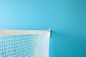 White Netting Against a Teal Background Perfect for Sports, Safety, or Decorative Designs. photo