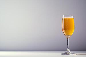 Sparkling Gold Beverage in Elegant Glass. A sophisticated image perfect for celebratory occasions or luxury product marketing. photo
