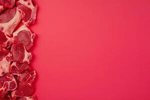 Raw Beef Steaks on Vibrant Red Background Culinary Image with Copy Space. photo