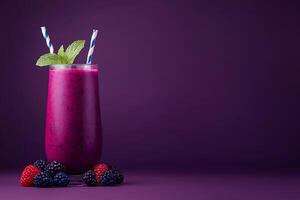 Refreshing Berry Smoothie in Tall Glass with Mint Garnish. A vibrant image perfect for showcasing healthy eating and delicious drinks. photo