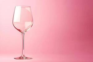 Elegant Empty Wine Glass on Pink Background. Perfect for Beverage, Celebration or Product Placement. photo