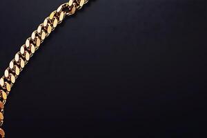 Gold Chain on Black Background Luxury Jewelry Image. A high-resolution image of a gleaming gold chain diagonally positioned against a dark background, perfect for design projects. photo