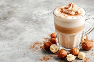 Delicious Hazelnut Latte with Whipped Cream and Cinnamon. A delightful autumnal beverage. photo