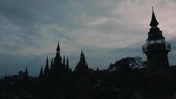 Silhouette of Castle and Lighthouse Against Moody Sky video