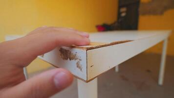 Worn-Out White Table with Hand Touching Edge video