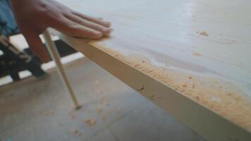 Smoothing a Wooden Surface in Woodworking video