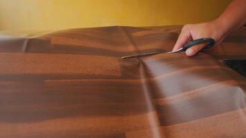 Cutting Wood-Patterned Material with Scissors video