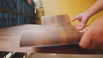 Arranging Printed Wood Texture Sheets Outdoors video