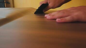 Hands Smoothing a Surface with a Tool video