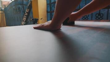 Hands Using Tool on Flat Surface in Outdoor Workspace video