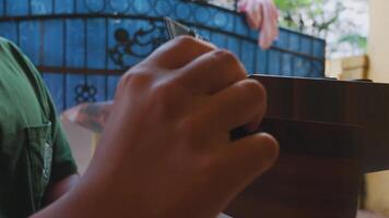 Child's Hand Gripping a Wooden Object video