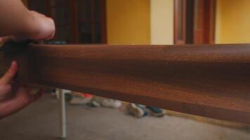 Hand Sanding a Wooden Surface in Outdoor Setting video