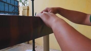 Close-up of Hands Holding Smartphone on Table video