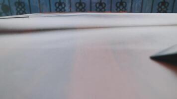Hand Reaching for Object on Wooden Surface video