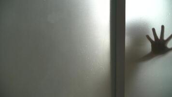 shadow of the right hand and left behind the glass is wet video