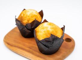 Golden Caramel Apricot Muffins on Wood Board Side View of Perfect Sweet Breakfast photo