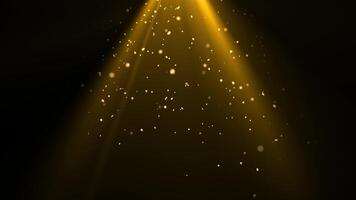 Golden particles gracefully float in warm spotlight beams on a dark background. Perfect for elegant, festive, cinematic, or magical atmosphere design in videos