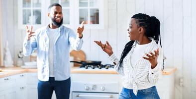 Domestic Fight. Portrait Of Annoyed Black Spouses Emotionally Arguing In Kitchen, Young African American Couple Suffering Problems In Relationship, Blaming Each Other For Marital Crisis, Closeup photo