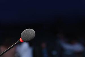 Microphone in a lecture environment with a blurred background photo