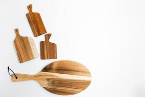 Displaying various wood cutting boards in an organized layout for kitchen use and presentation photo