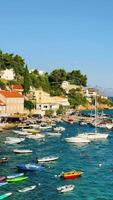 Exploring the beautiful waterfront of Mimice in Croatia with boats and clear blue waters video