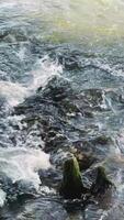 Serene Waterscape Featuring Mossy Rocks by a Flowing River that Invites Calm video