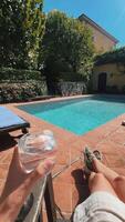 Enjoying a Relaxing Poolside Experience on a Beautiful Sunny Day with Sunshine video