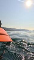 Kayaking Sea Sunlight. Paddle strokes water, sunny day, sea kayaking to island on a relaxing vacation. video