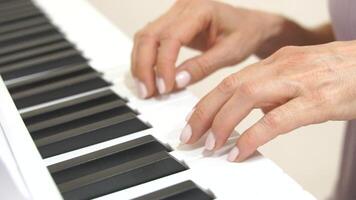 Hands Piano Keys Playing Music. Indoor close-up showing woman's hands playing a keyboard. video
