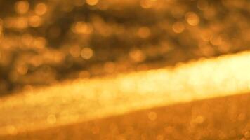 Bokeh Lights Blurred Background Abstract - Close-up photograph of a blurred background featuring golden bokeh lights, likely taken indoors with a shallow depth of field. video