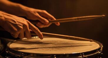 Drummer's Hands Playing Snare Drum with Wooden Drumsticks, Close-Up, Dark Background, Musical Instrument photo