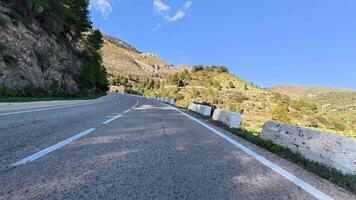 The view of the winding mountain road is absolutely breathtaking, beautifully surrounded by lush greenery all around video