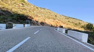 Embark on a scenic journey along a beautiful winding mountain road, perfect for thrilling adventures video