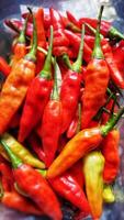 Red Hot Chilli Peppers' pattern, texture, and background. Close up. Landscape. A backdrop of Red Hot Chilli Peppers. traditional vegetable market. Group of Red Hot Chilli Peppers photo