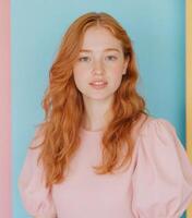 Portrait of Red-Haired Woman Against Colorful Background photo