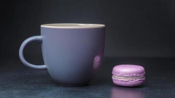 Lavender Mug and Pastel Macaron on Dark Surface photo