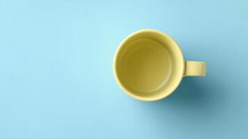 Pastel Yellow Mug on Bright Blue Background photo