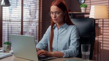 Caucasian businesswoman working laptop in office looking at camera crossed hands in stop enough gesture no not sign forbid deny business woman girl female at table confident manager reject arms symbol video