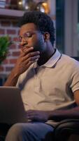 Thoughtful businessman African American guy thinking business man searching idea in evening office consider decision male trader employee think project plan online late working laptop in dark night video