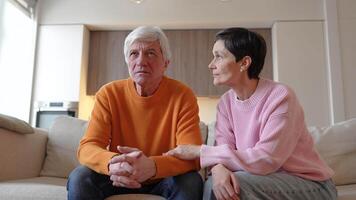 Troubled sad senior man and wife calm him down. Stress burnout, midlife crisis, supportive woman video