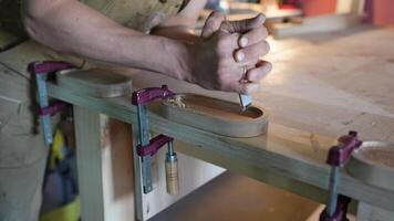 Focused woodworker hands final sanding, polish coasters. Blade sandpaper for refining wood surface video